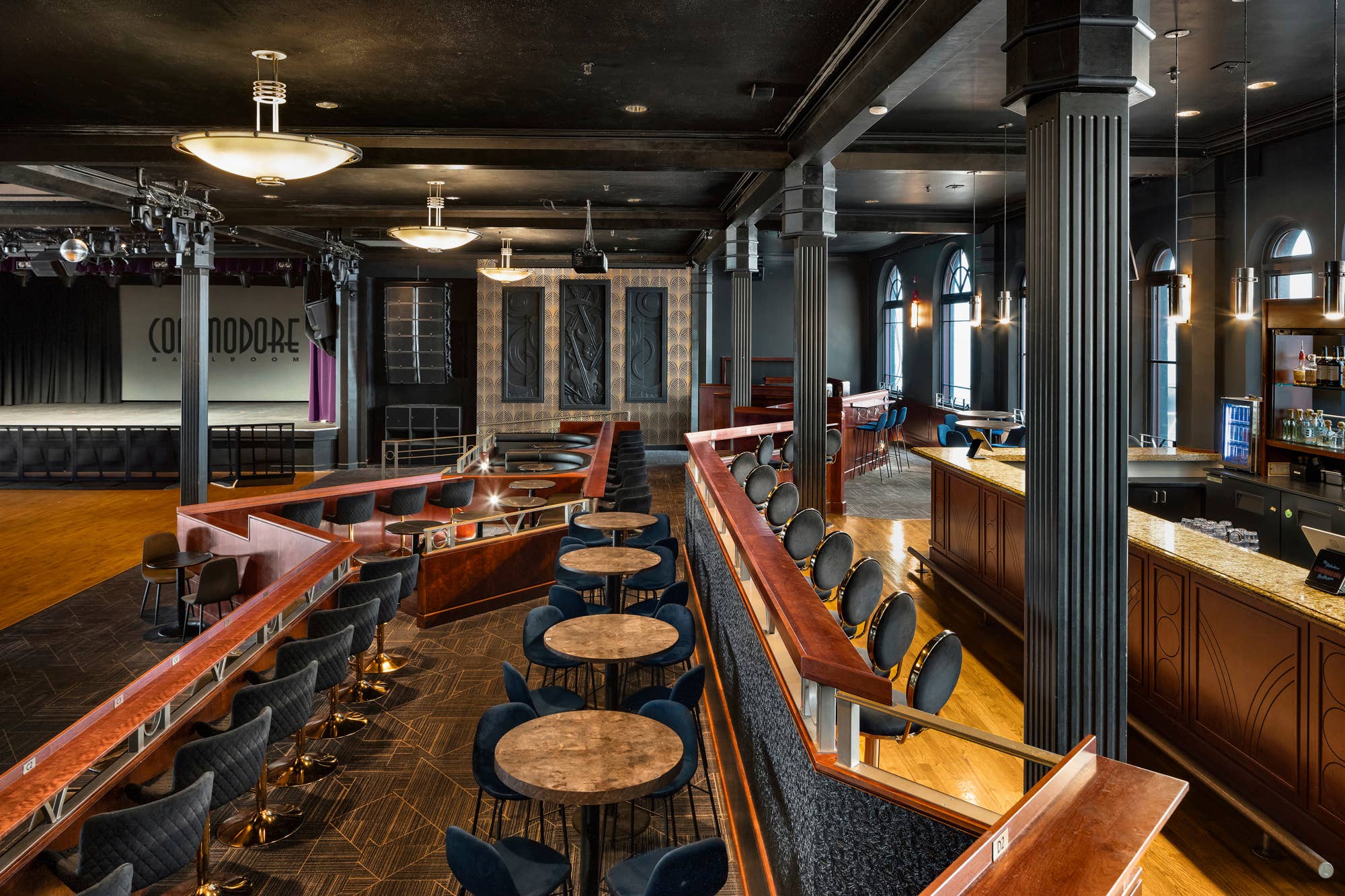 view of table seating and bar seating at commodore ballroom 
