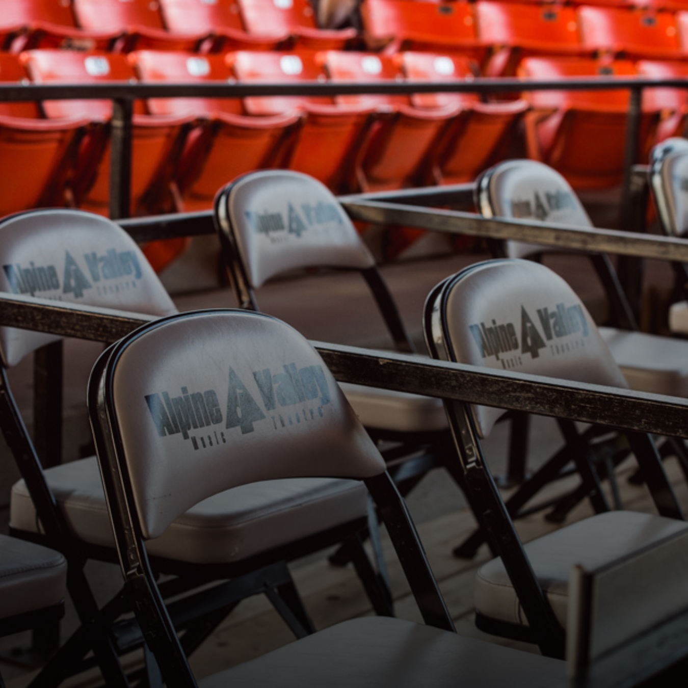 Leather back chairs with the Alpine Valley Music Theatre logo on them.