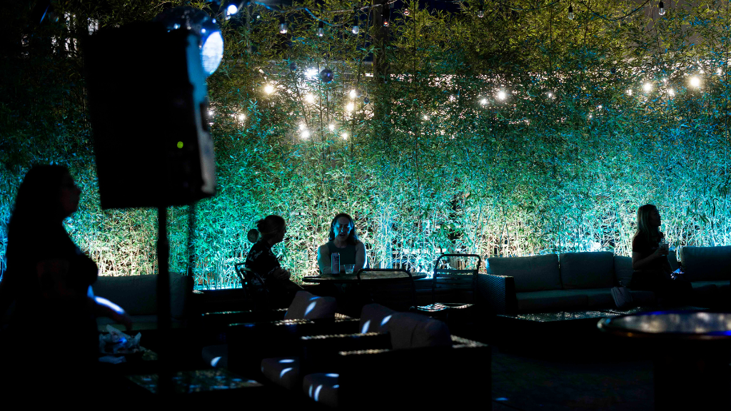 Punch Line Philly's outdoor patio lit up with green lights