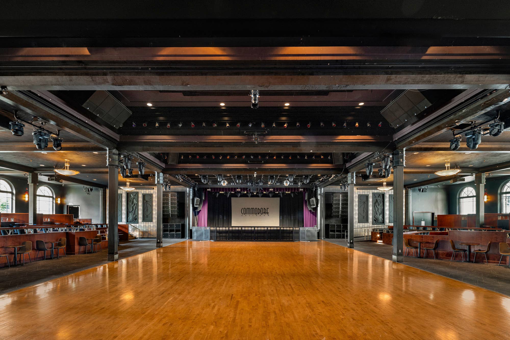 view of the empty commodore ballroom venue from the back of the venue looking onto an empty stage