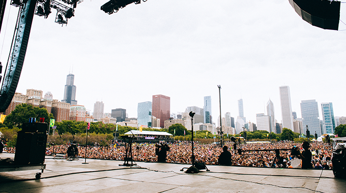 Urban cityscape with touring crew members and equipment cases