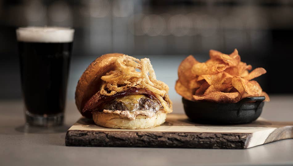 A burger, beer, and chips