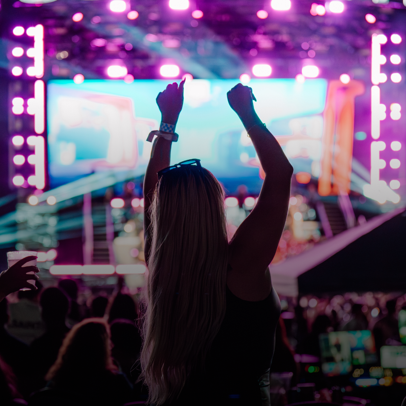 Backshot of Woman Dancing With Stage In Front Of Her