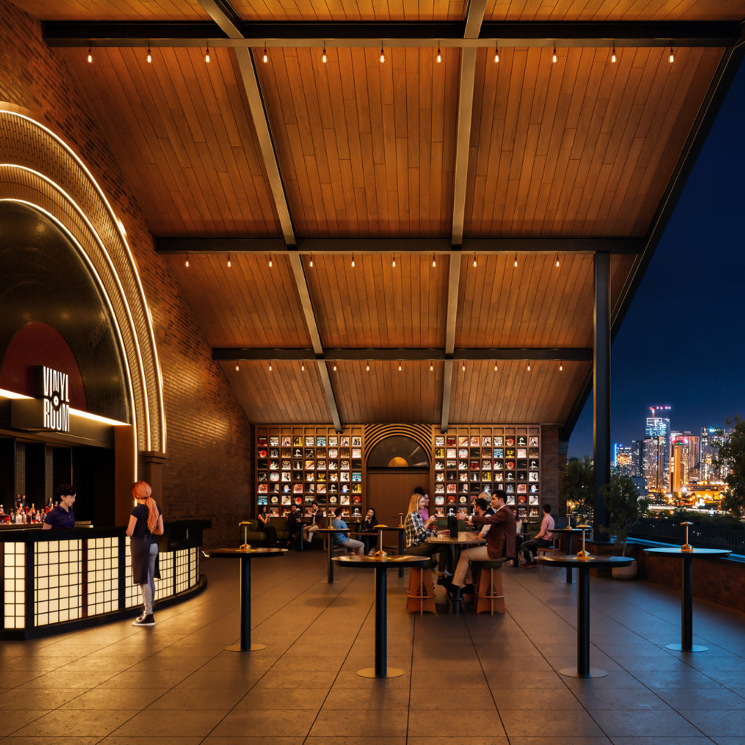 A covered terrace with high top tables and a fully stocked bar