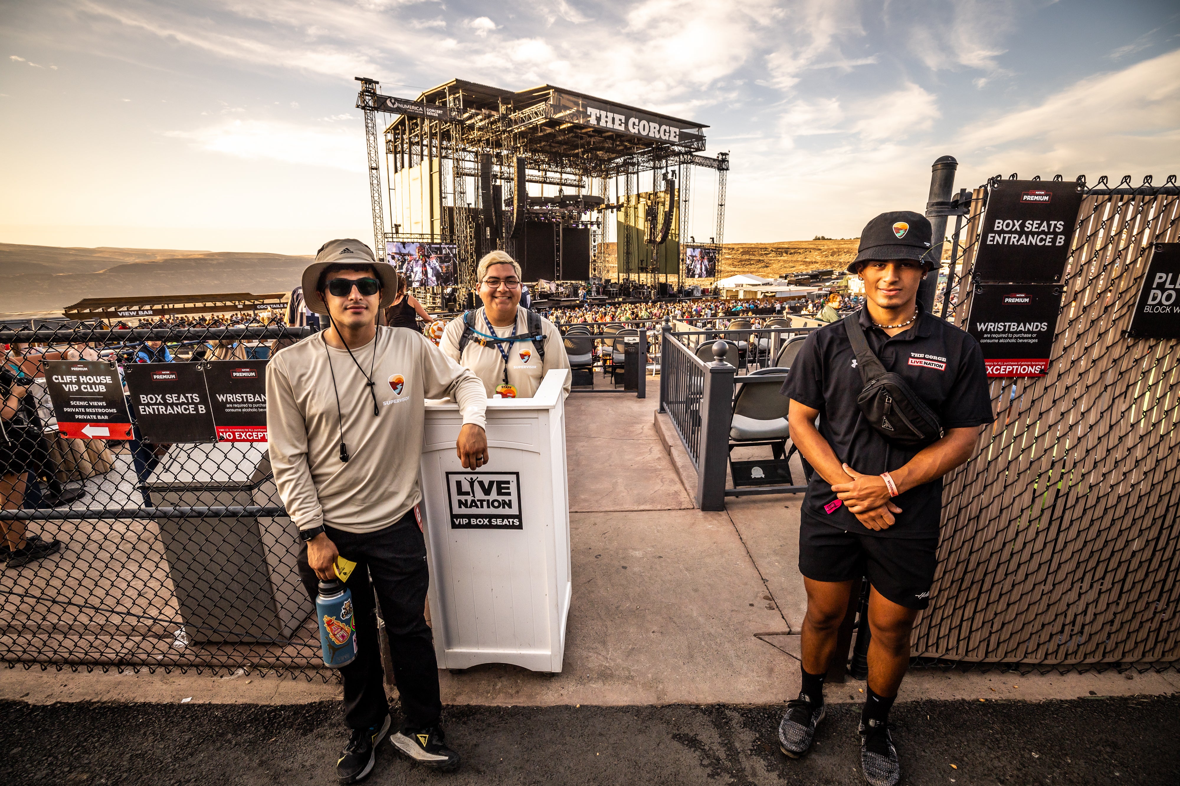 Employees standing in front of the VIP stage viewing area 