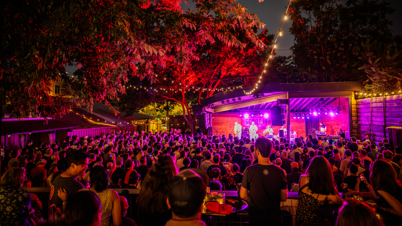 Fans enjoying a show at Scoot Inn