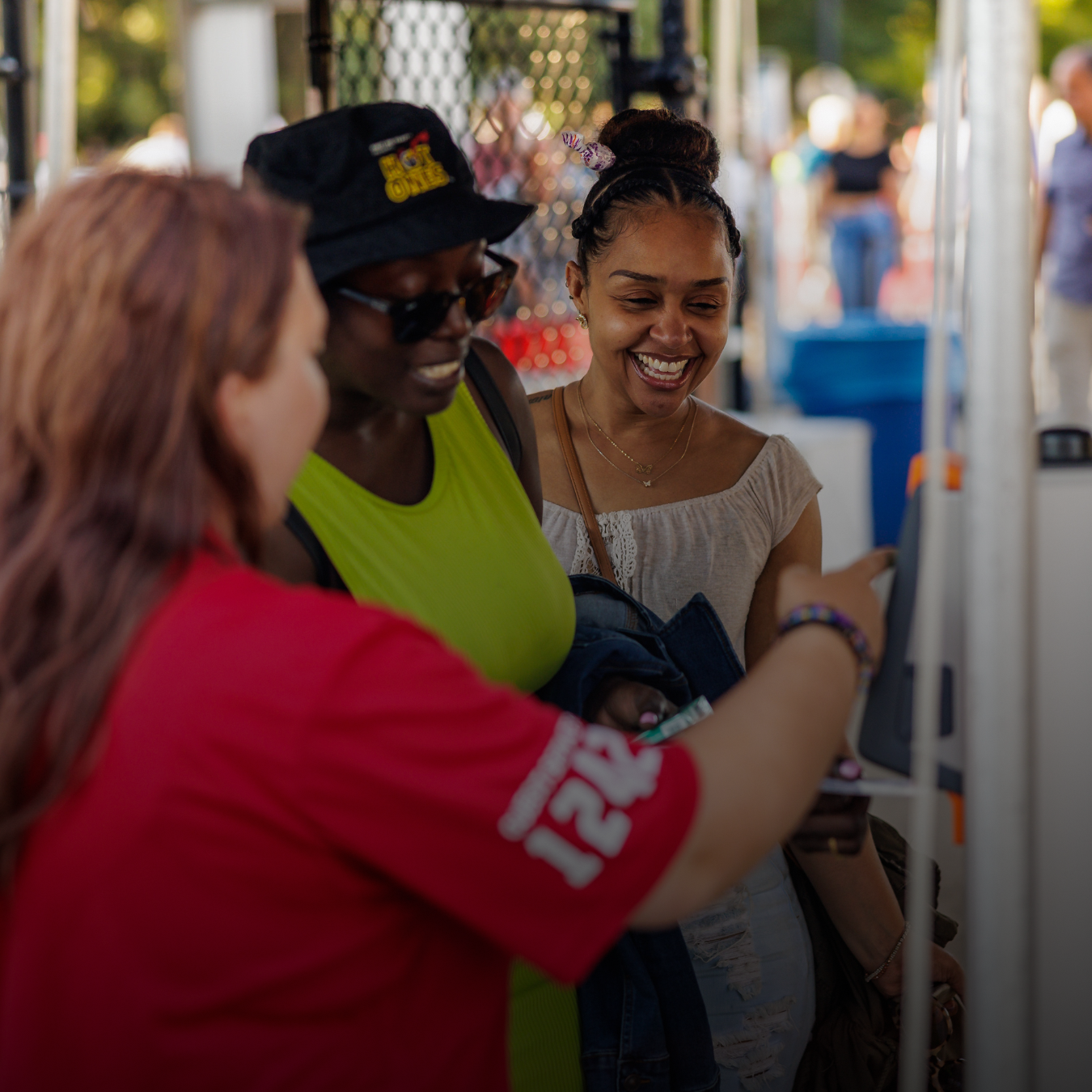 A guest service is scanning attendees' tickets