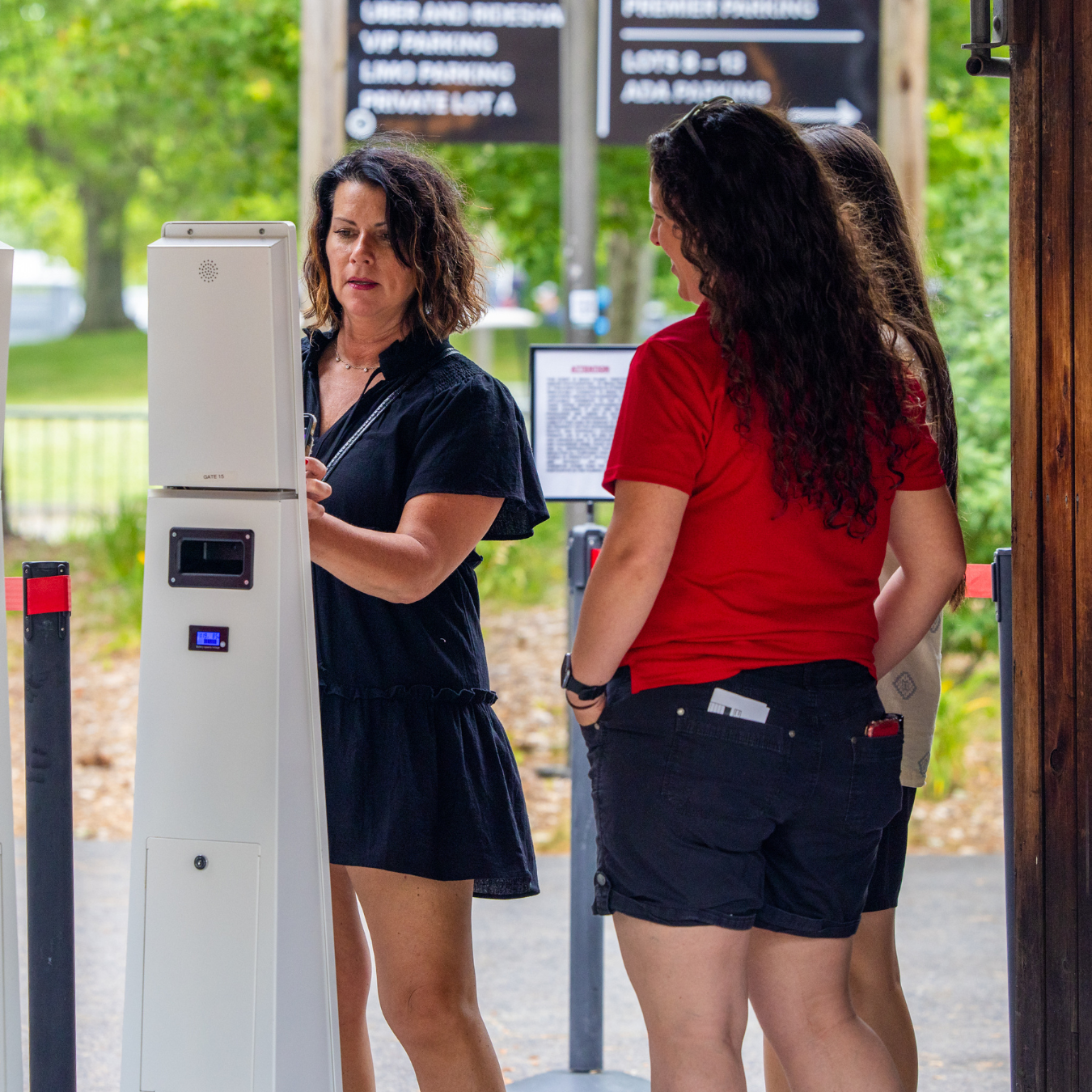 A patron scanning her ticket at the VIP gate