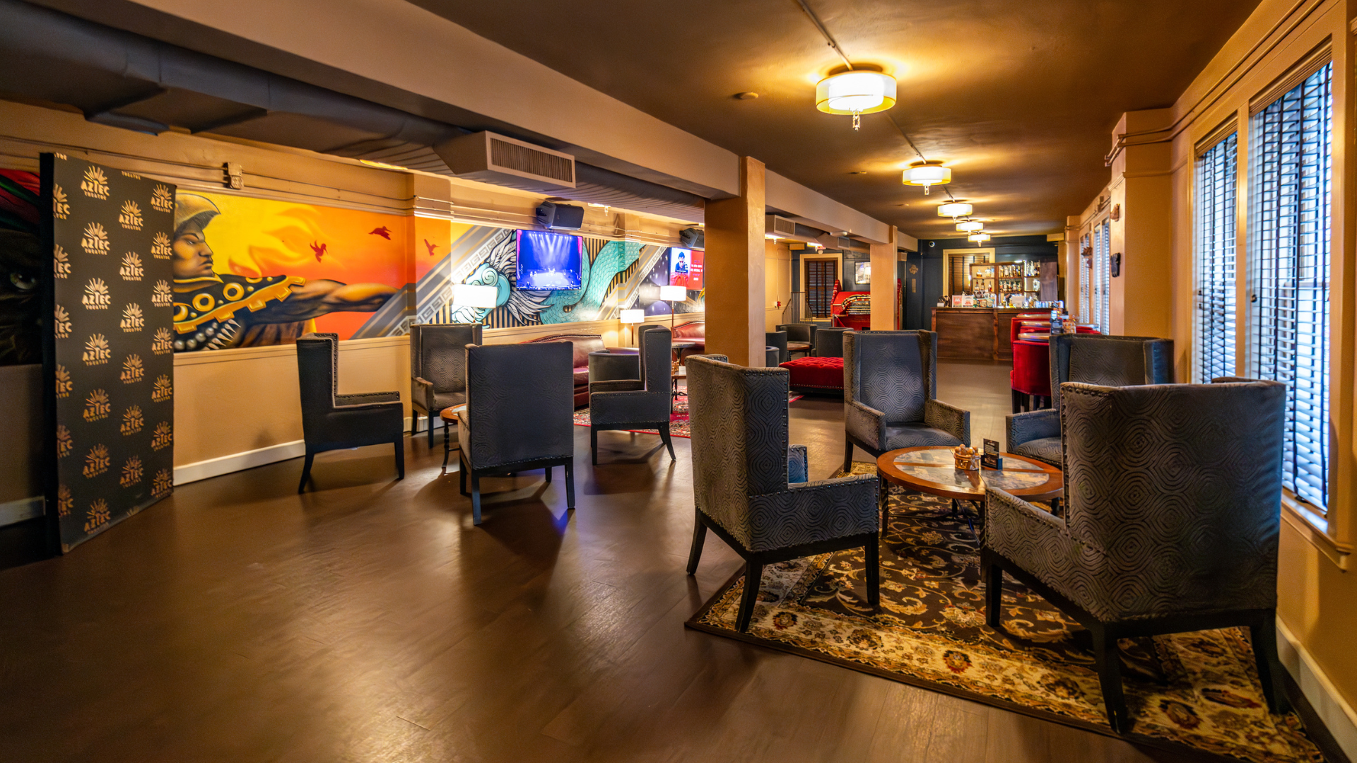 Photo of the inside of the Aztec Theatre's Warrior Room, showing couches and chairs.