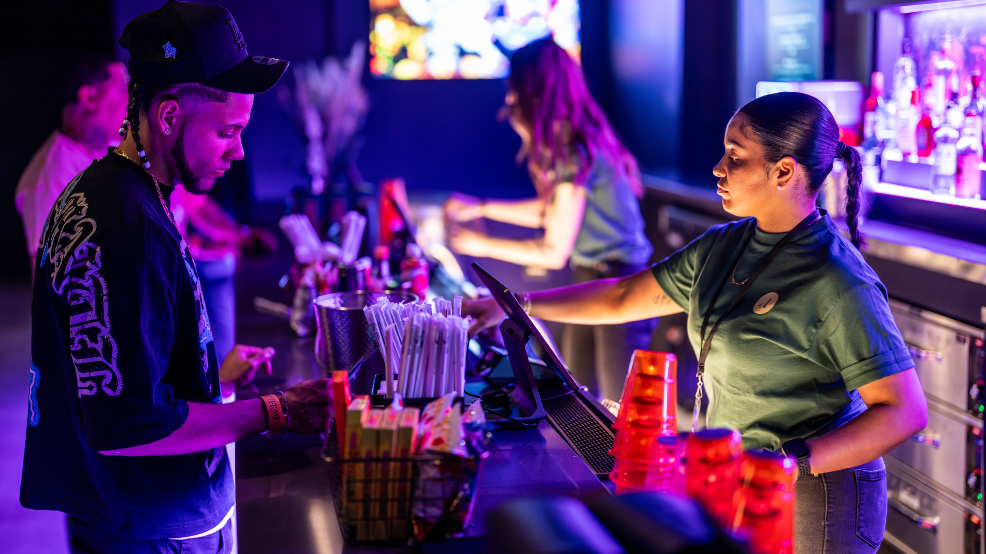 A fan makes a purchase at Archer Music Hall.