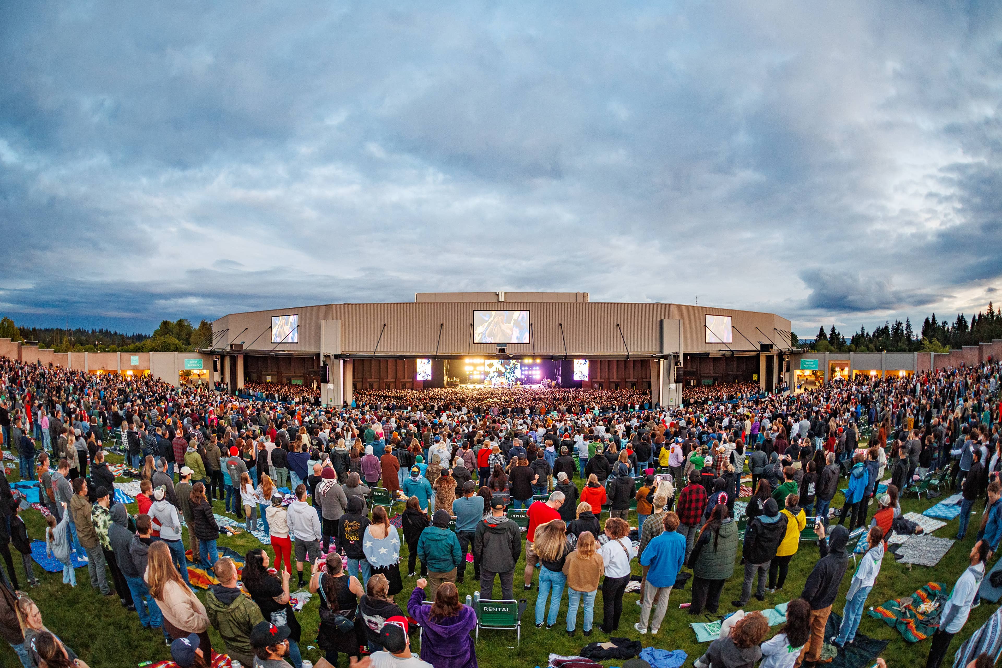 a wide angle photo from the back of the lawn showing the whole crowd during a show