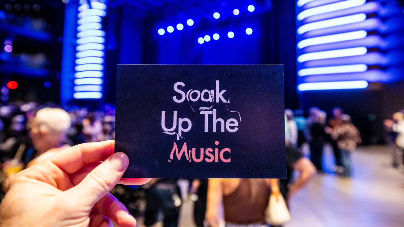 A card that states "Soak Up The Music"