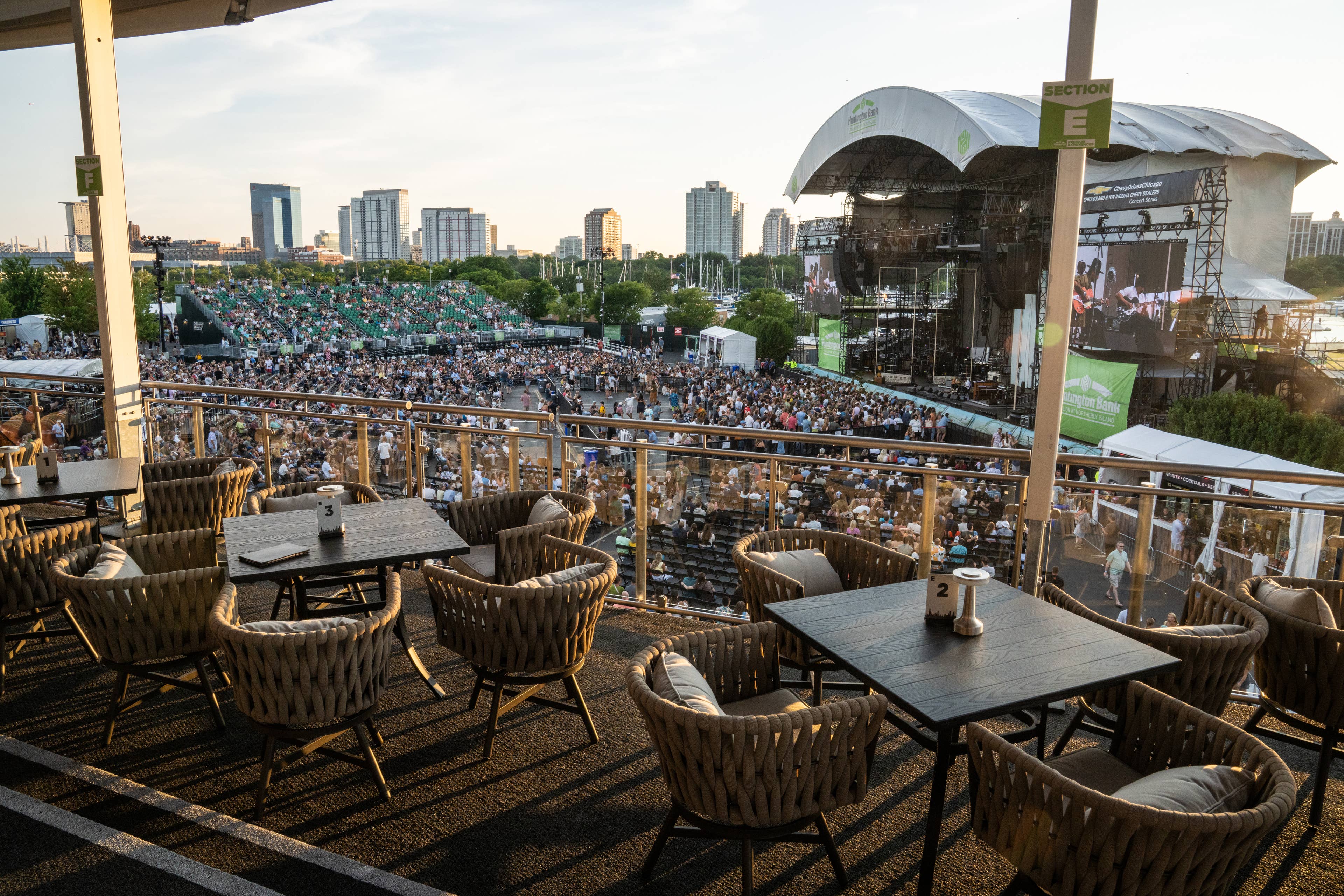 This is an image of the premium seating area's point of view overlooking the stage. It shows tables and chairs set up and also views the skyline of the city.
Live Nation presents Jack Johnson at Huntington Bank Pavilion at Northerly Island in Chicago, Illinois on July 11, 2026. (Photo by ALIVE for Live Nation)