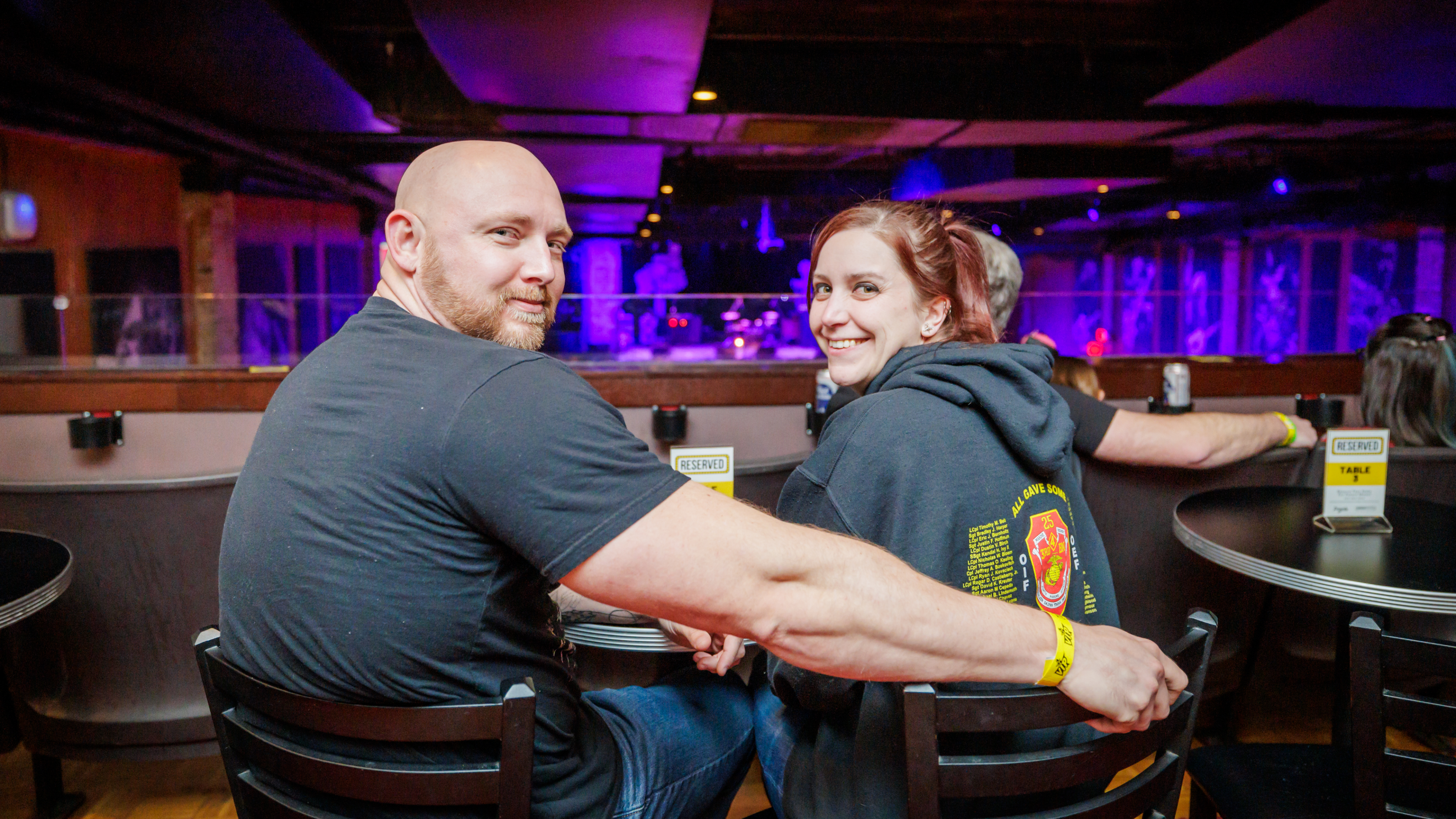 Two people sitting down at a table at Bogart's