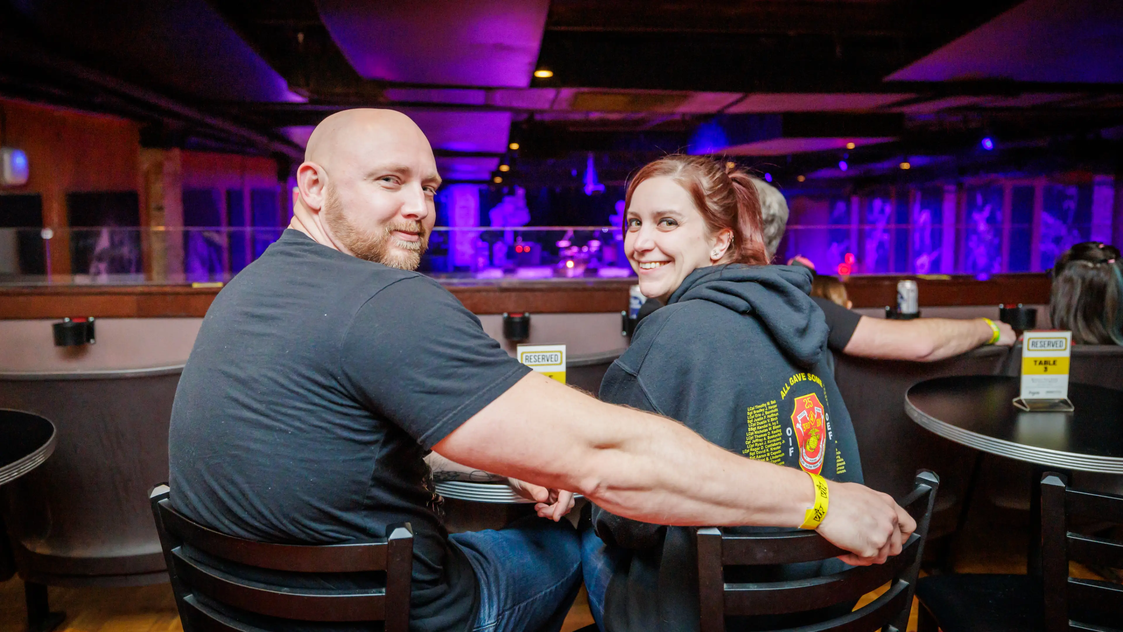 Two people sitting down at a table at Bogart's