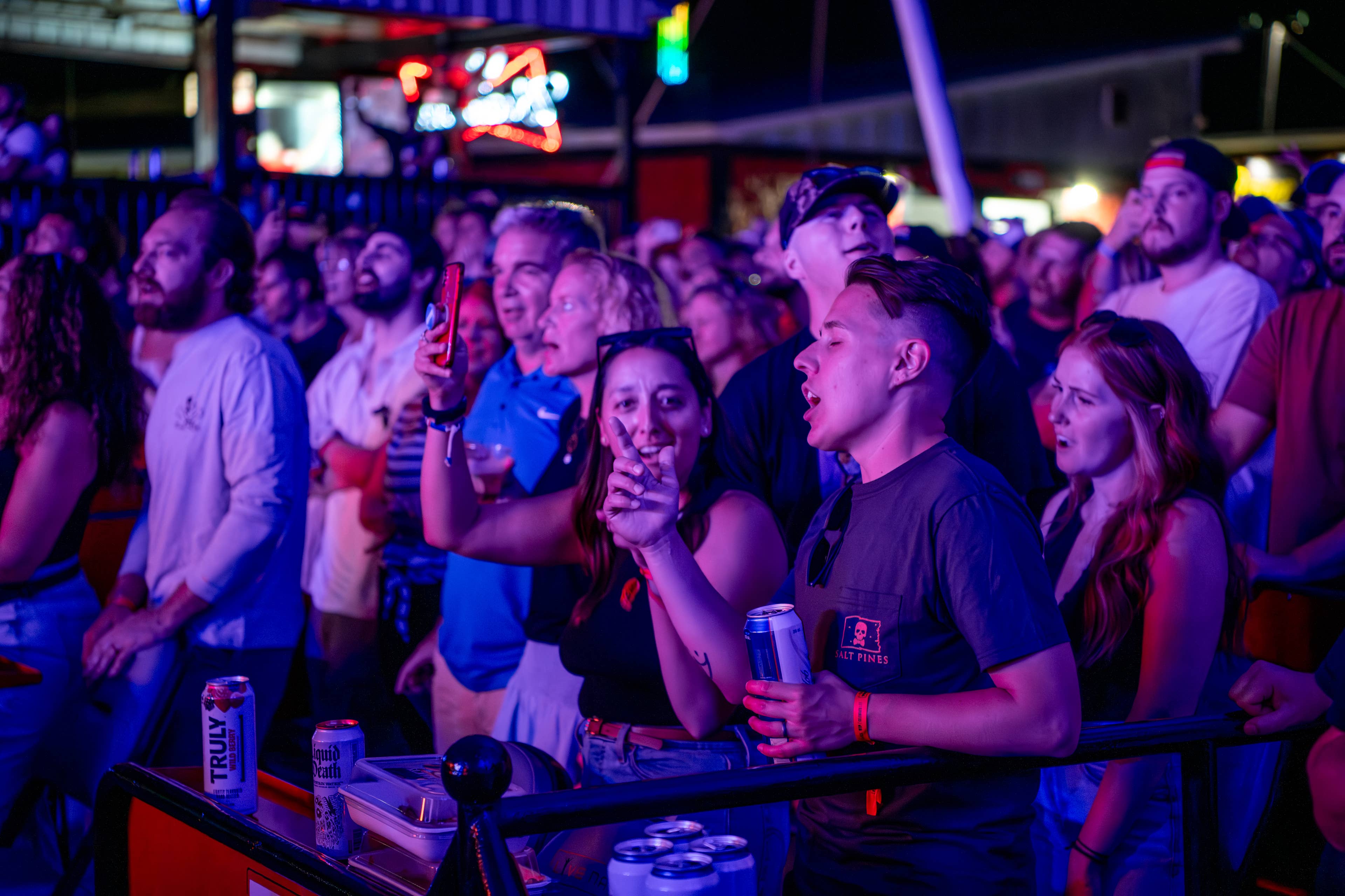 fans singing in a premium seating box