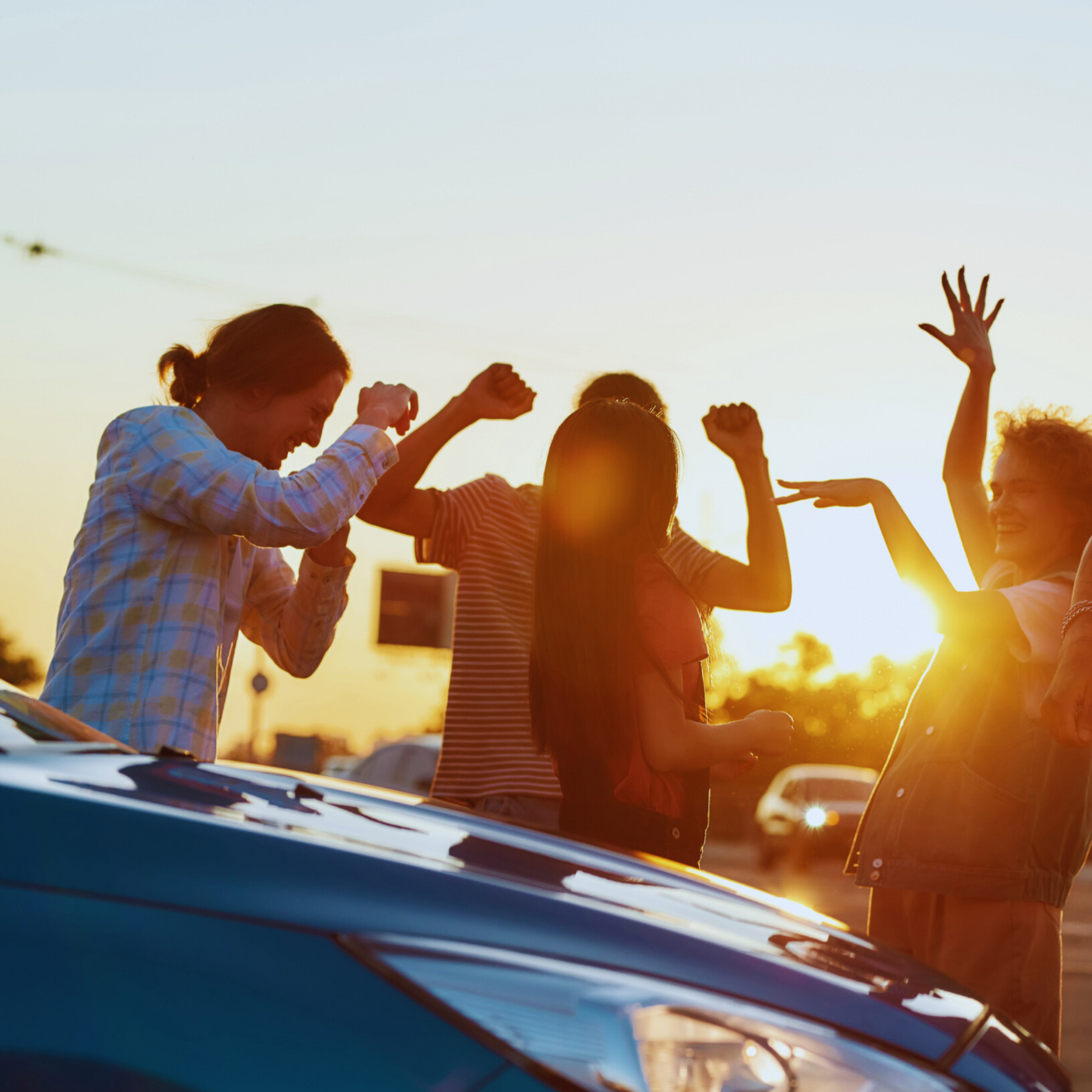 People dancing around in the parking lot