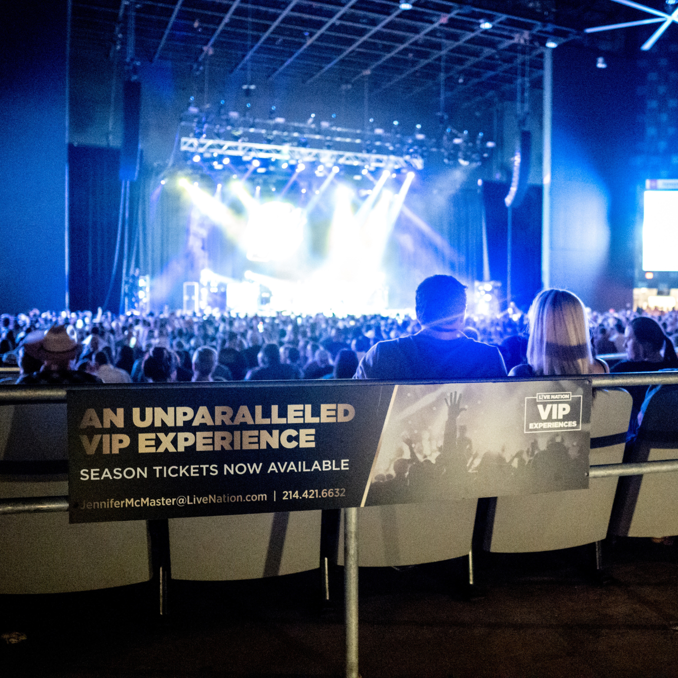 People sitting in the VIP section facing the stage