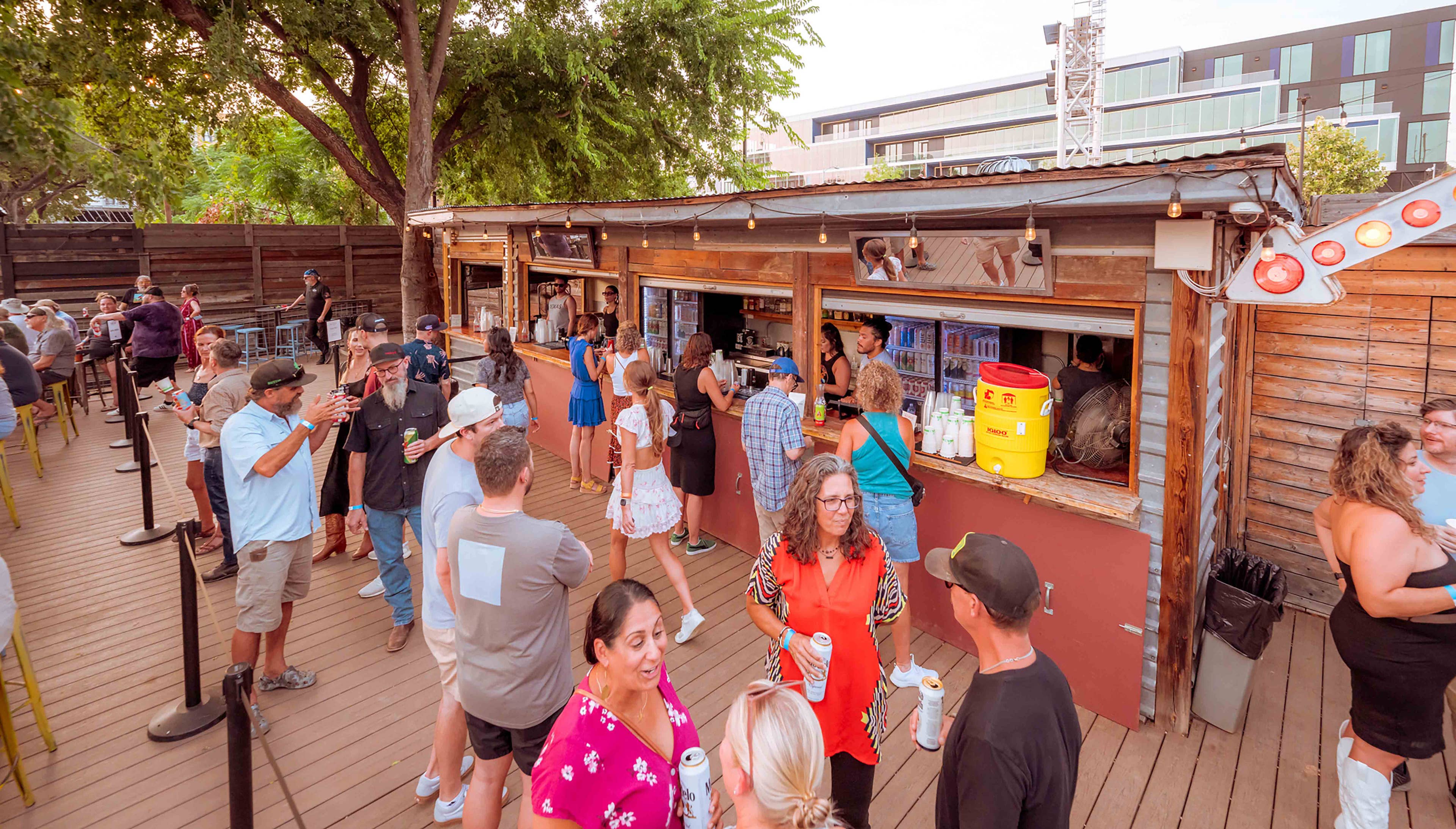 People buying drinks at Scoot Inn