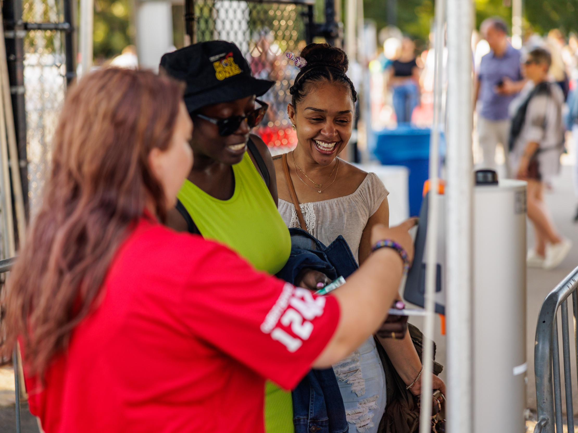 A woman scans her ticket at the entrance to Huntington Bank Pavilion.