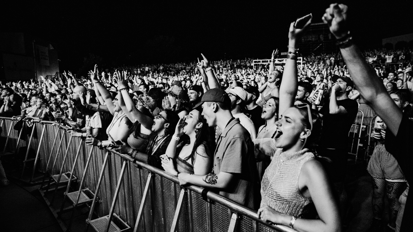 A photo of a packed pit of Briston Maroney fans at Skyla Credit Union Amphitheatre.