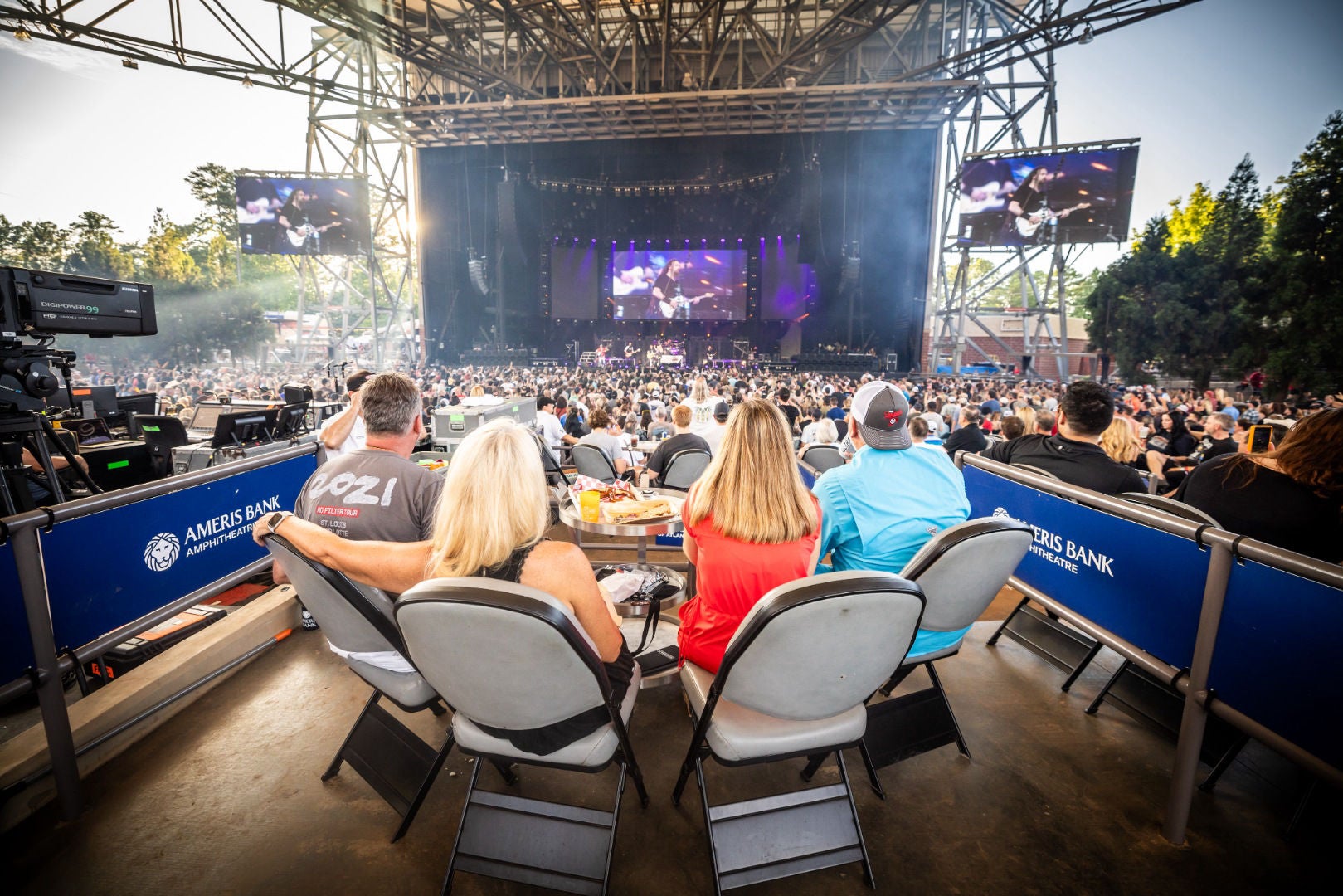 People sitting at a table facing the stage