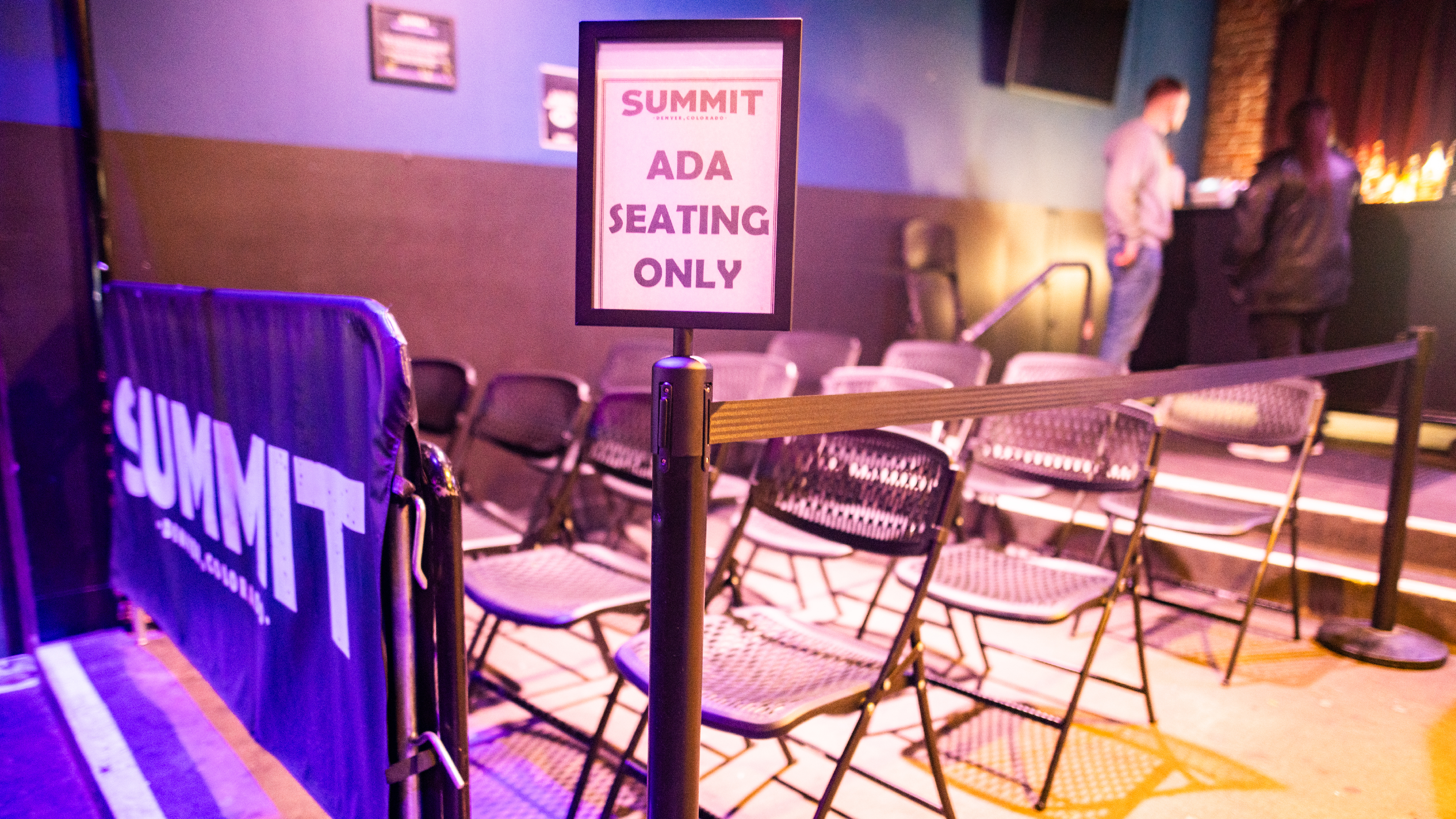 A sign shows where accessible seating is available inside Summit