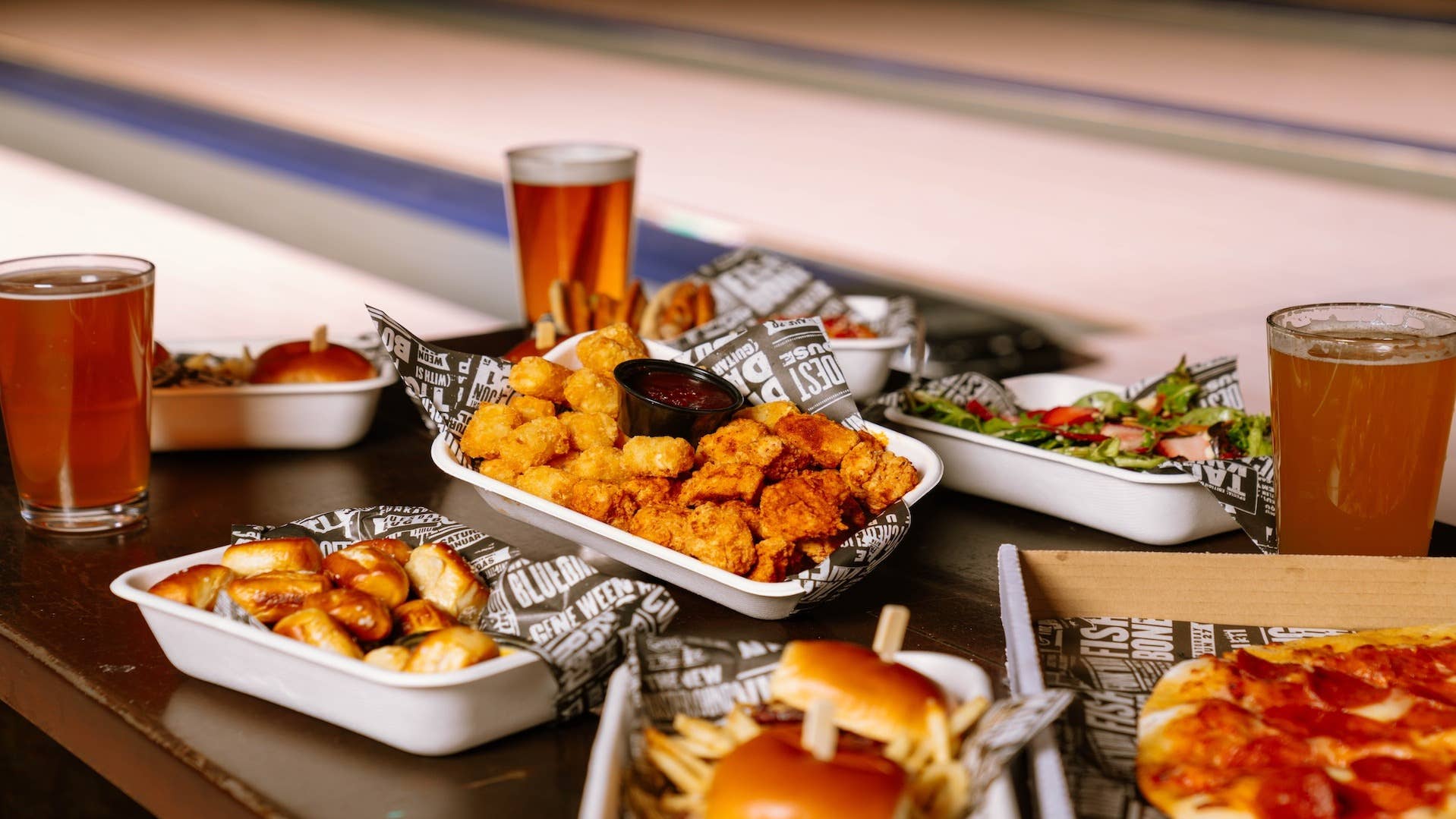Trays of food and drinks on a table