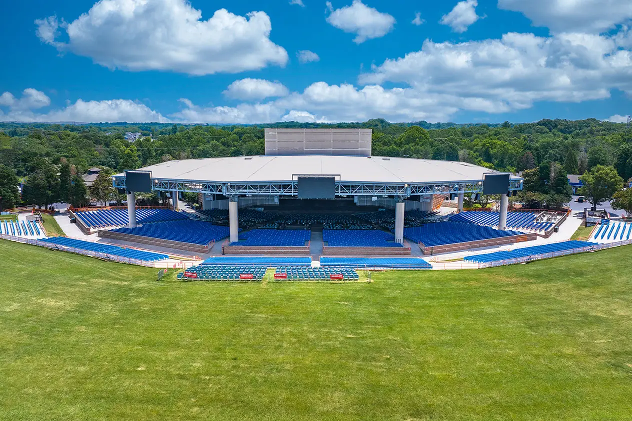 A picture of an empty stage and lawn area at Truliant Amphitheater.