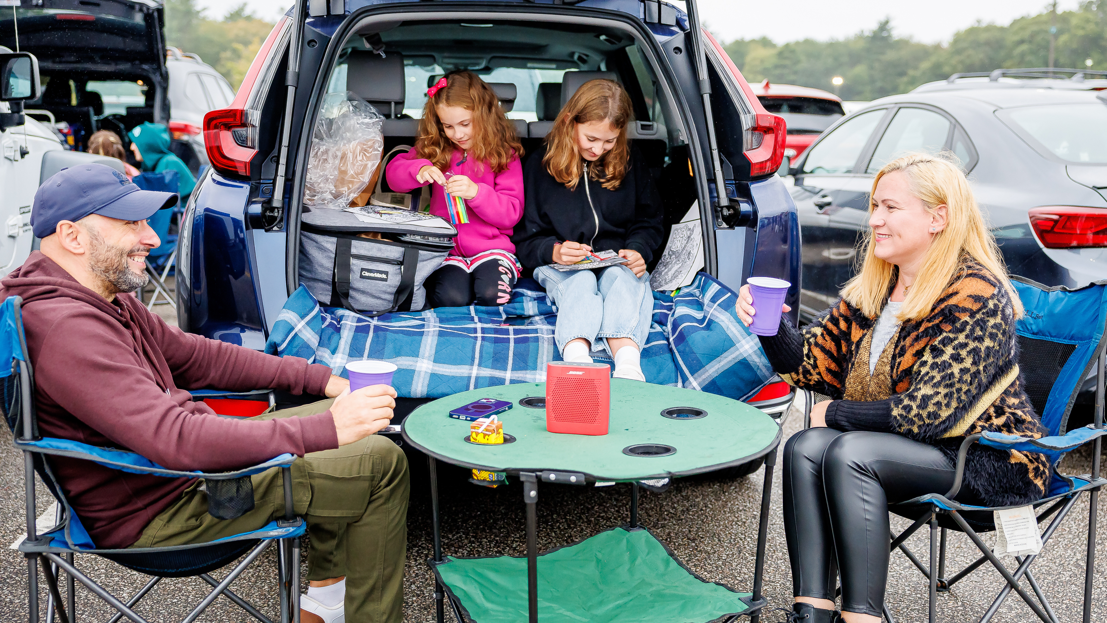 Family tailgating in the parking lot before a concert at Lakewood Amphitheatre