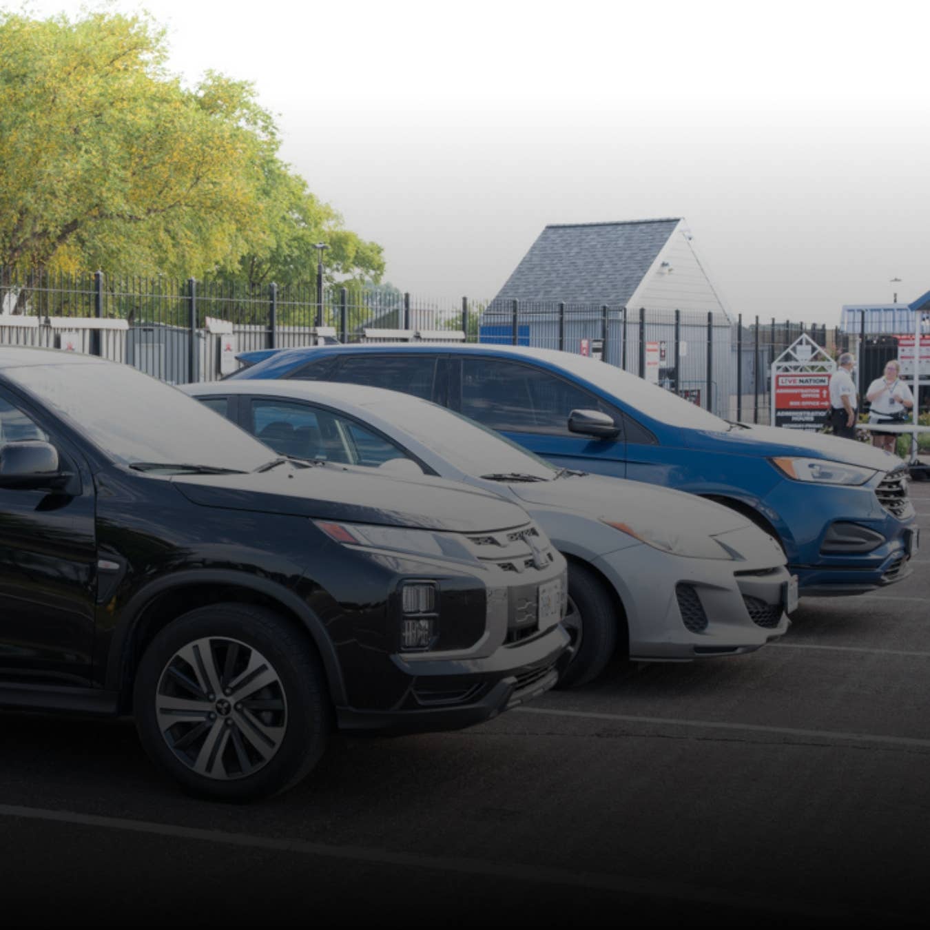 Cars are shown parked outside the amphitheater.
