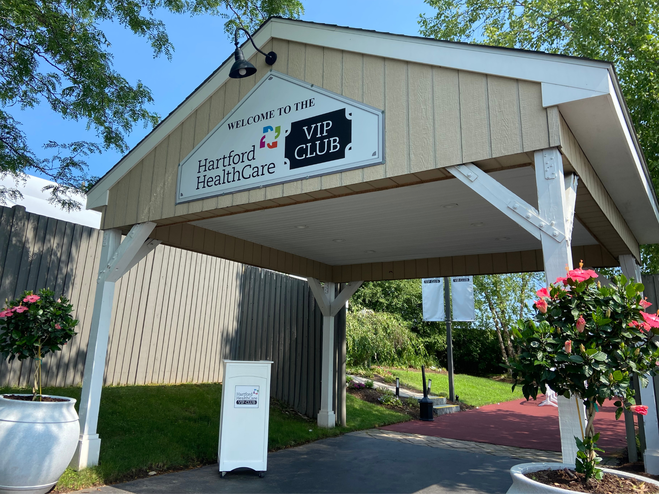 A sign to the entrance of the VIP Club at Xfinity Theatre