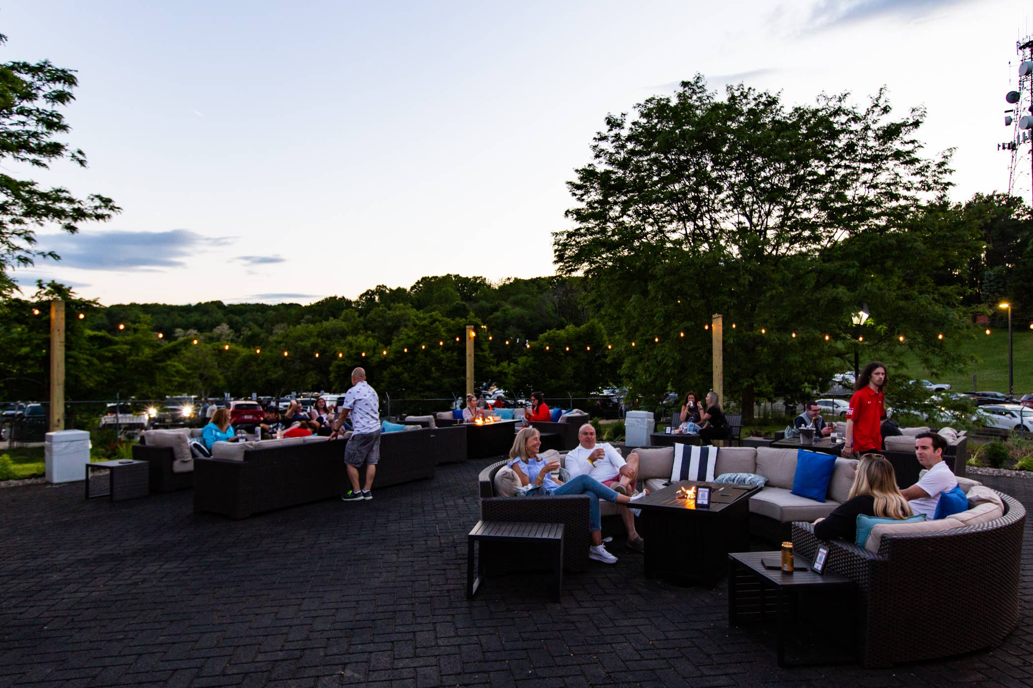 Attendees hanging out in the VIP Club Lounge area