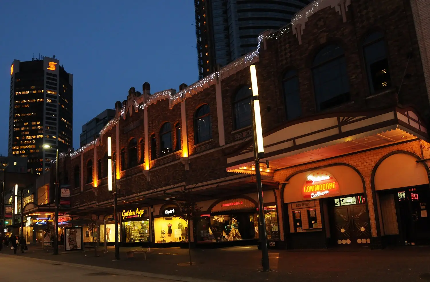 view of the entrance to commodore ball room from the outside including their light up sign