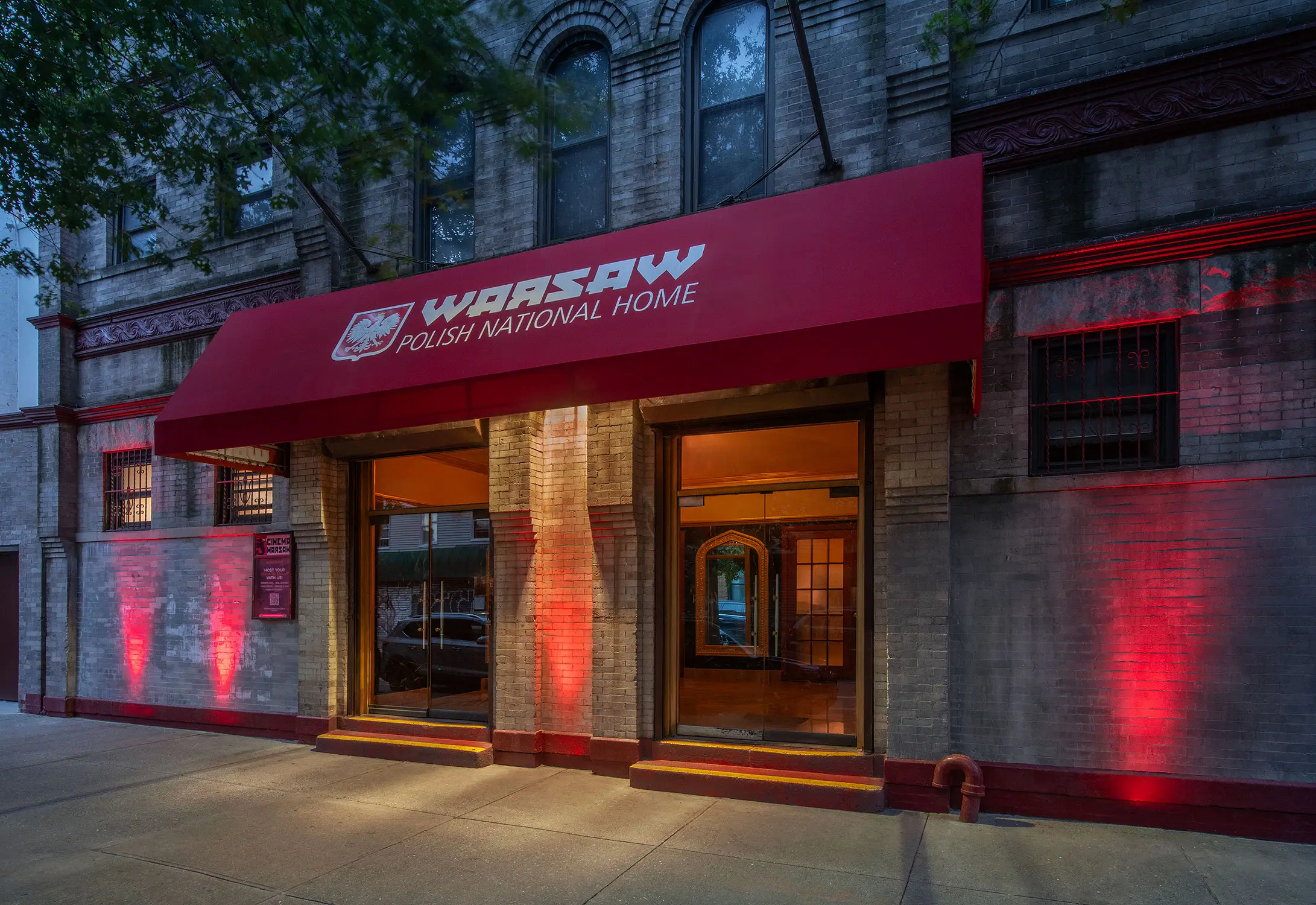 a photo of Warsaw's main entrance which features a red awning that says Warsaw Polish National Home above the double doors