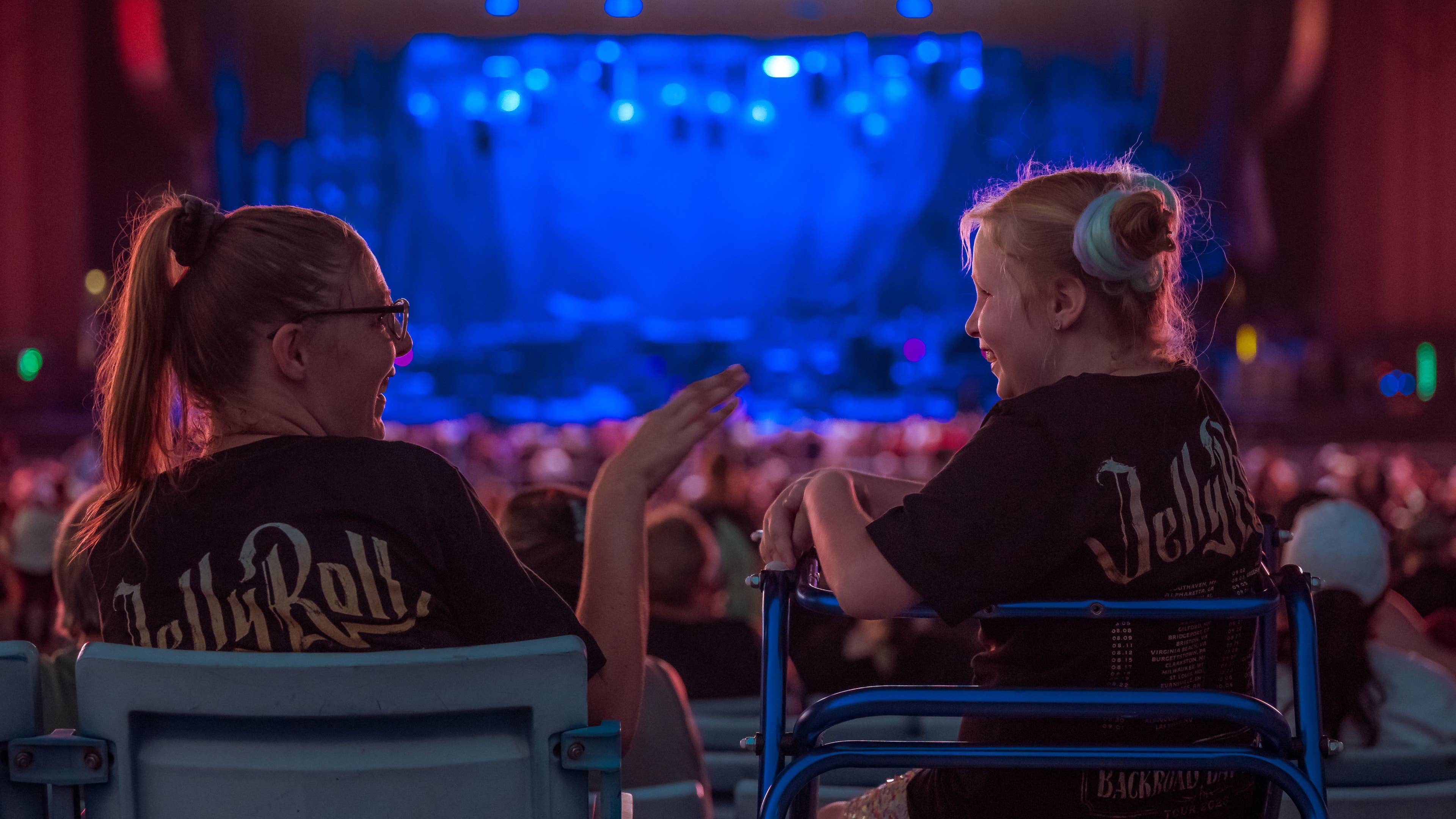 People chatting in Accessible seating section