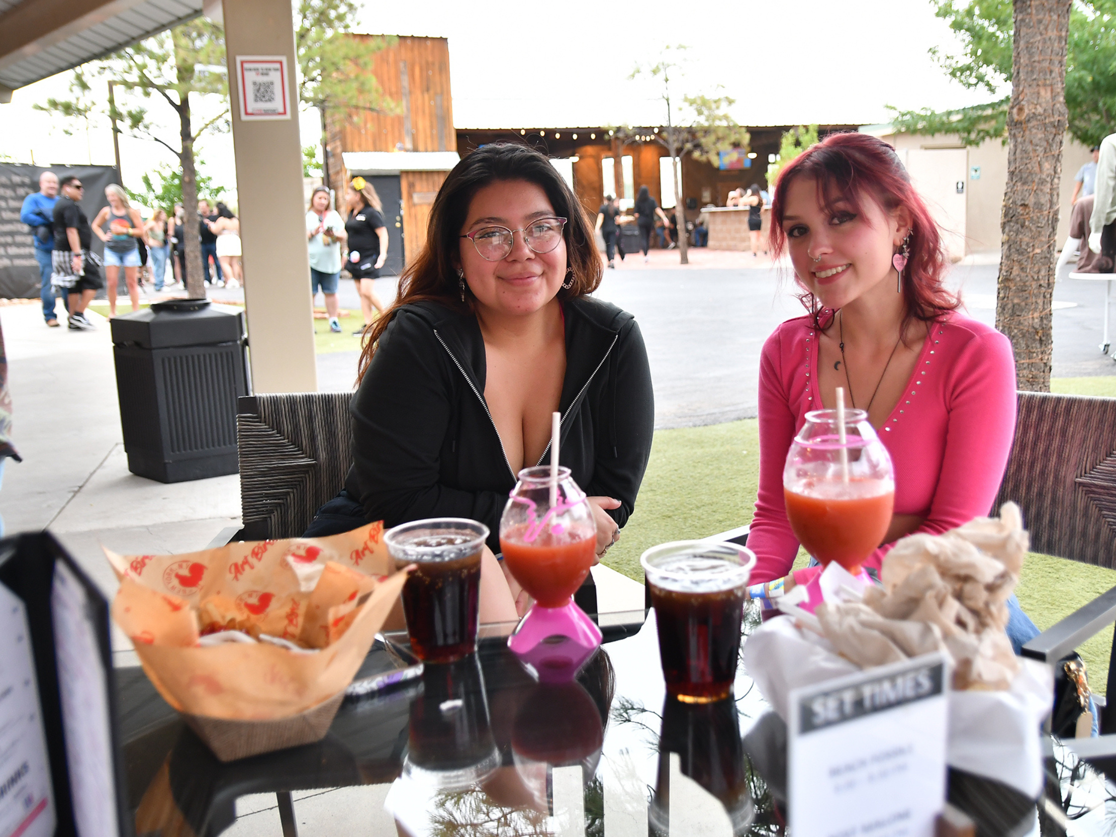 two women in VIP with food and drinks on the table 