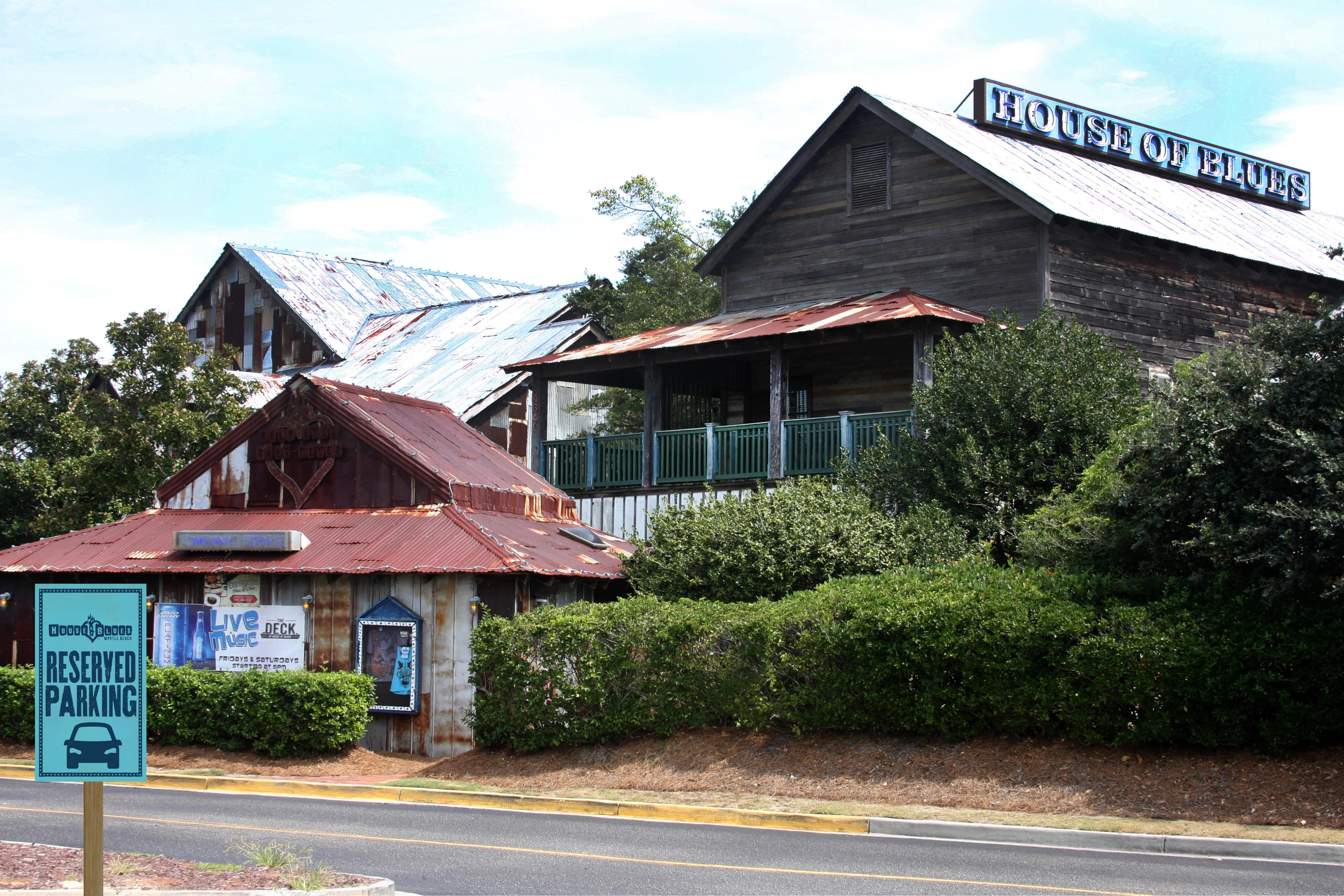 Photo of the front of House of Blues Myrtle Beach with a sign showing the premiere parking spaces. 