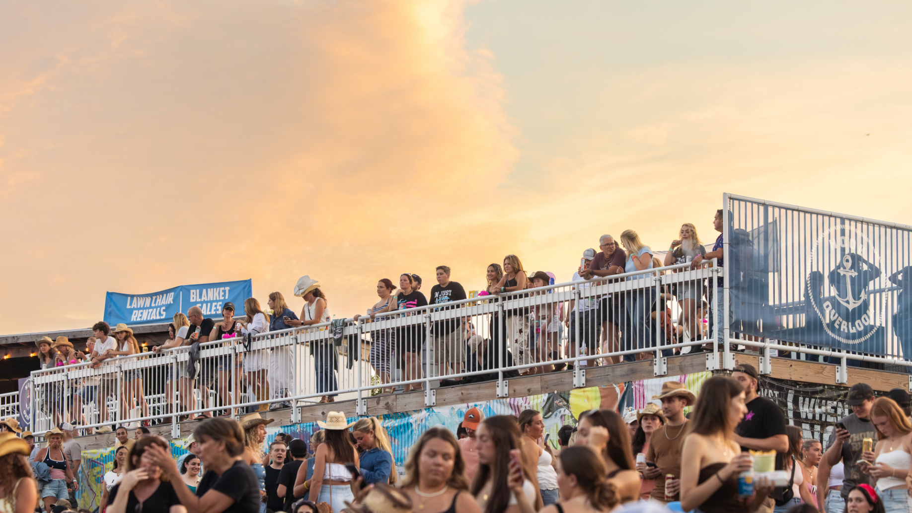 Fans standing on the party deck. 