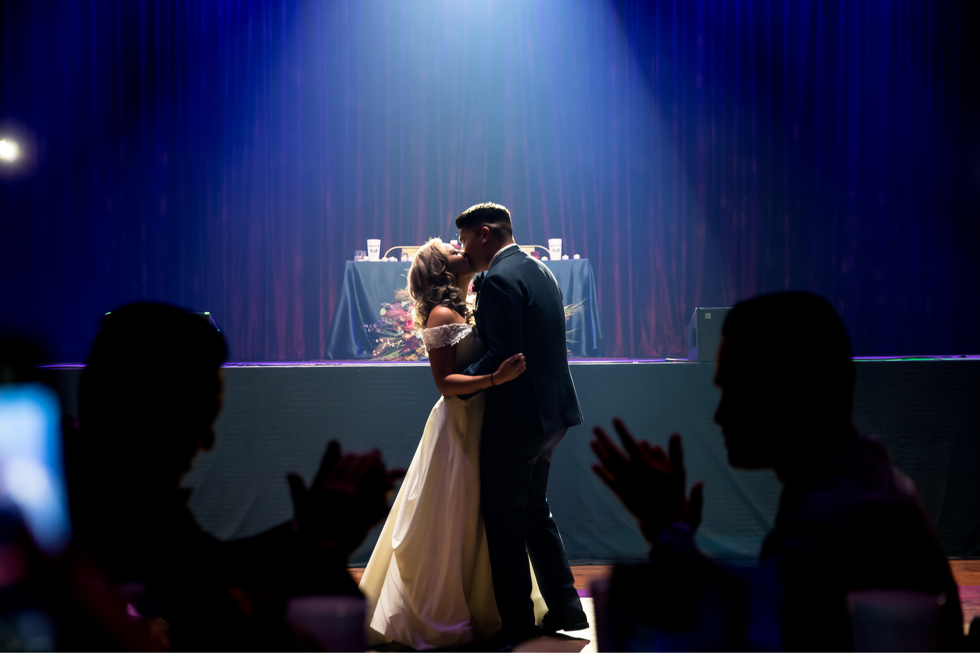 A couple kissing on the dance floor