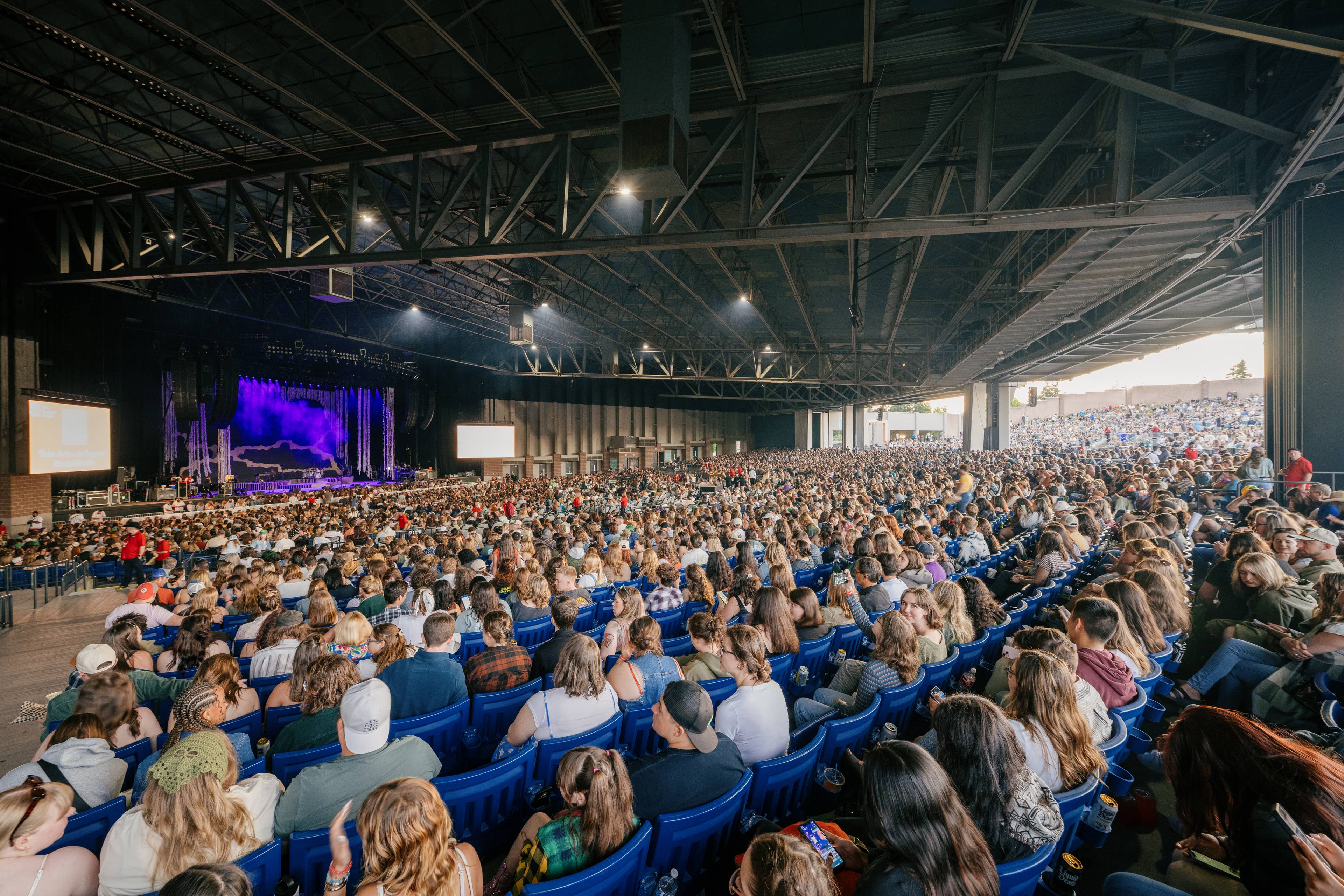 Fans sitting in their seats waiting for a show to start 