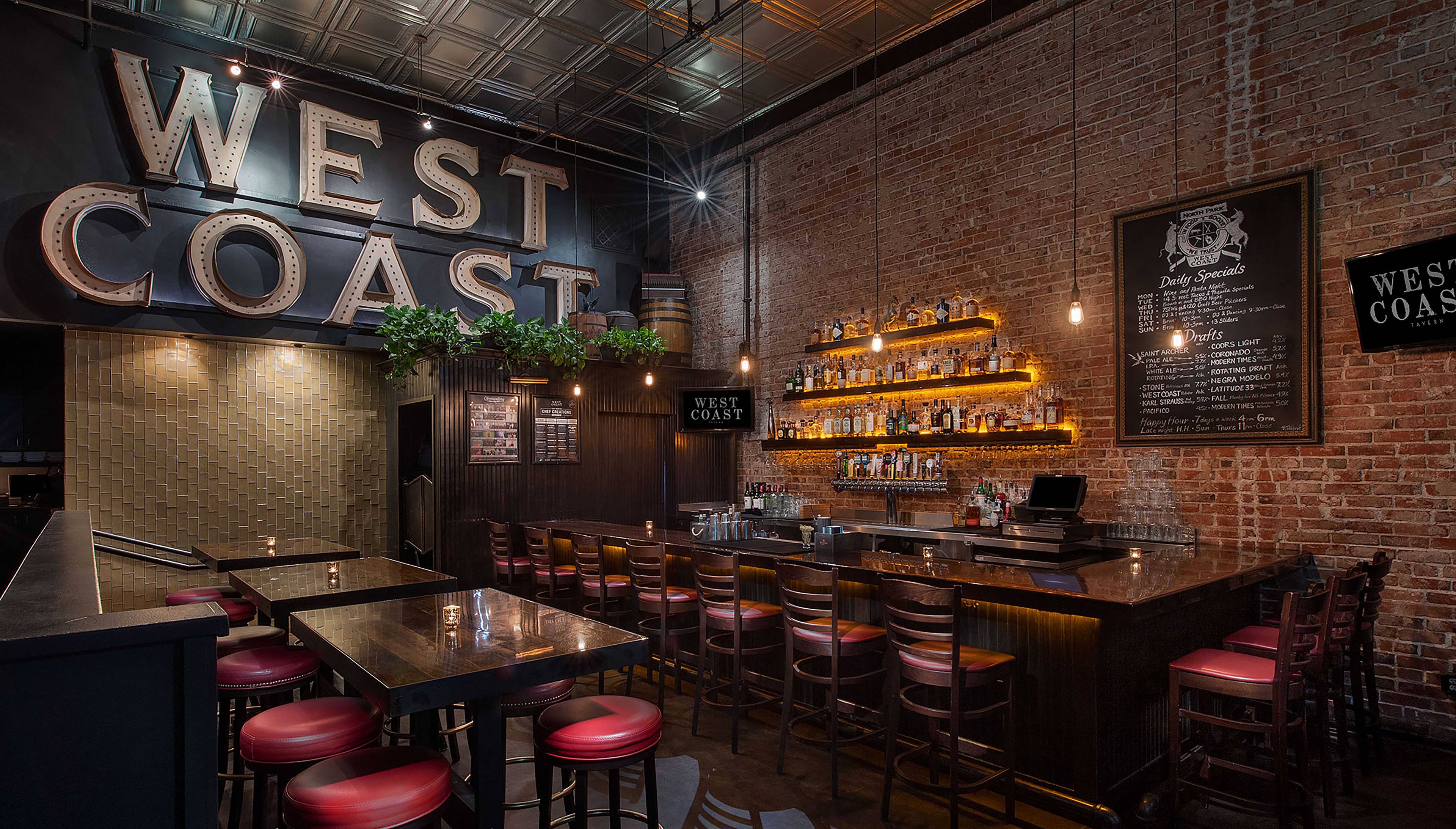An empty West Coast Tavern front bar and seating area.