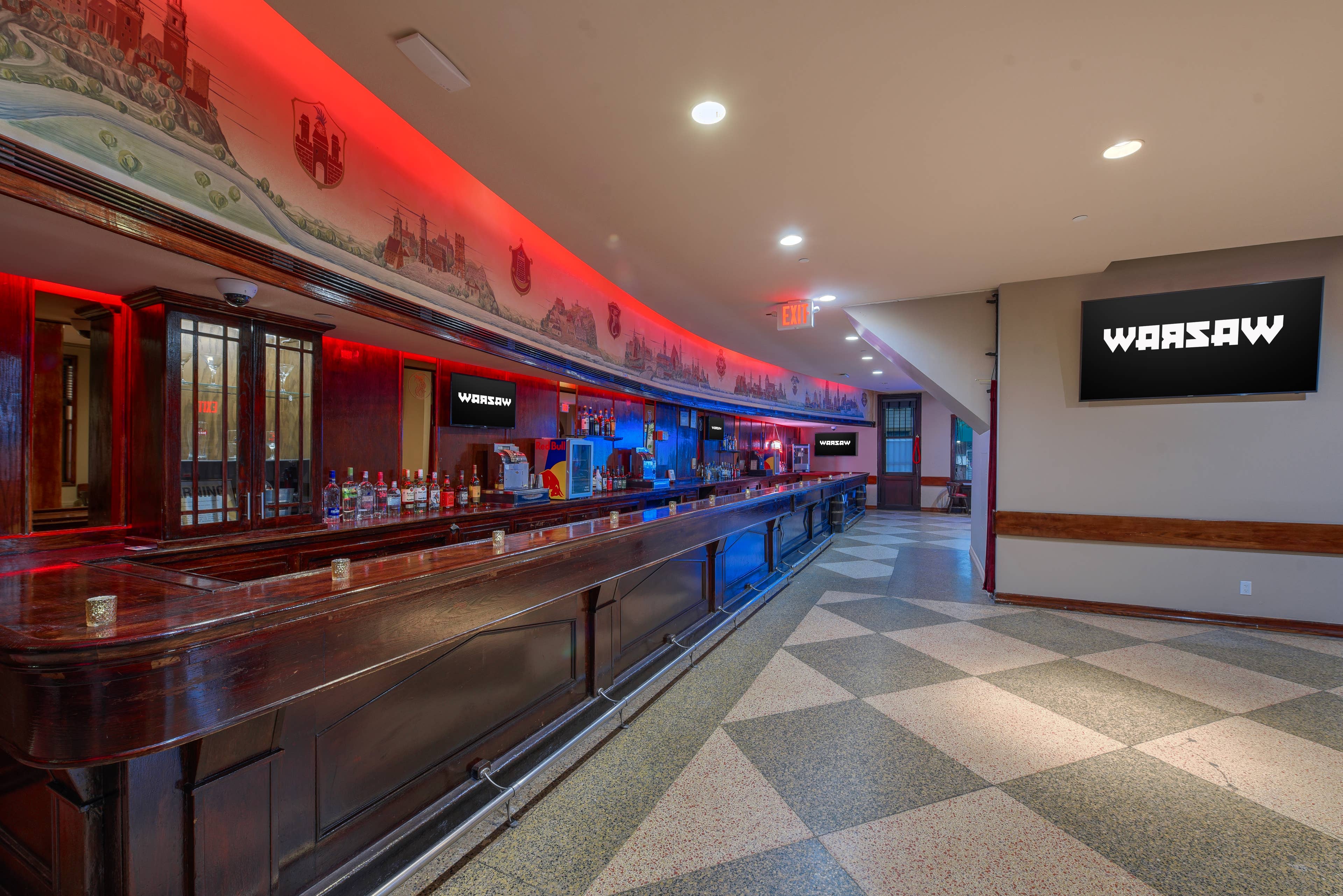 a photo of an empty Warsaw main bar which shows a unique mural above the bar
