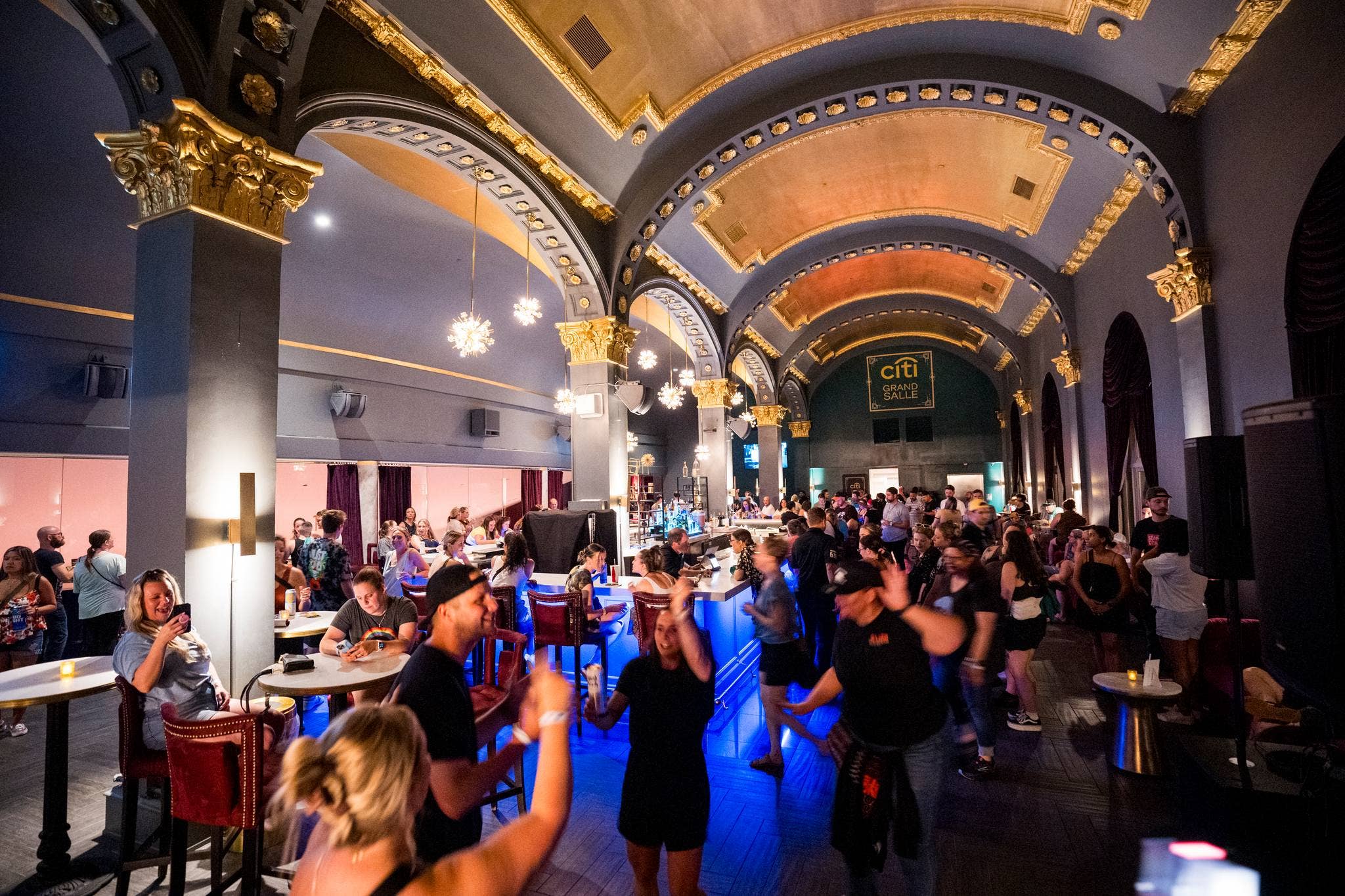 People hanging out in the main lobby of the venue