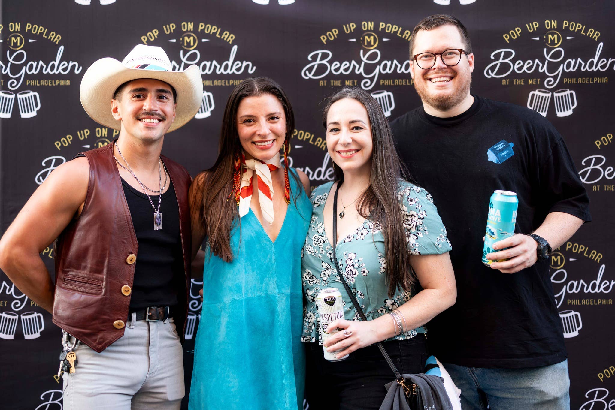 Four people smiling at the camera