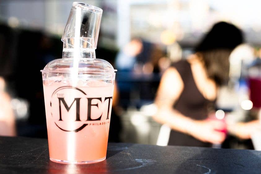 A shaker cup with The Met Logo on the cup