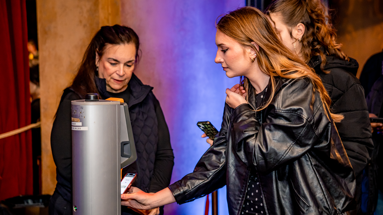 A fan scans their ticket to get into the venue.
